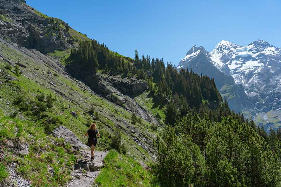 Kaitlan on the hiking trail using Tread TF Trekking Poles