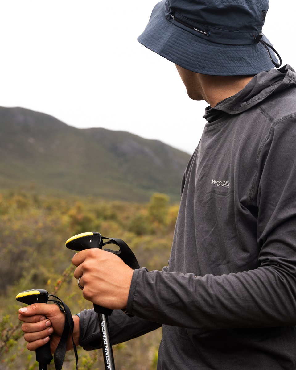 Close up of Tread Carbon Trekking Poles & Vapour Hooded Pullover