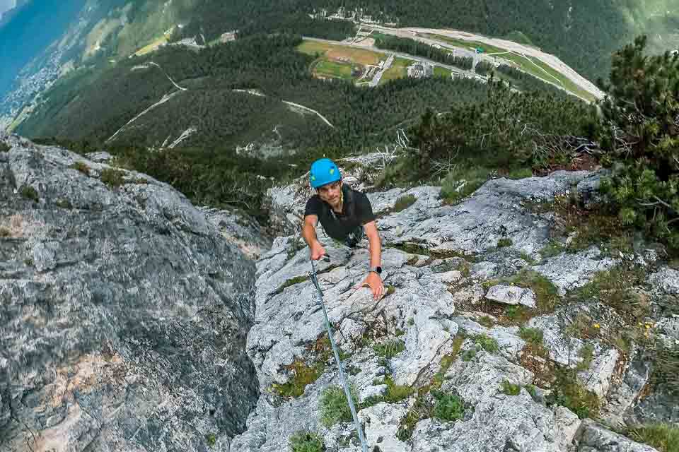 Wide fisheye shot of Zach Bostock cable climbing up the ascent