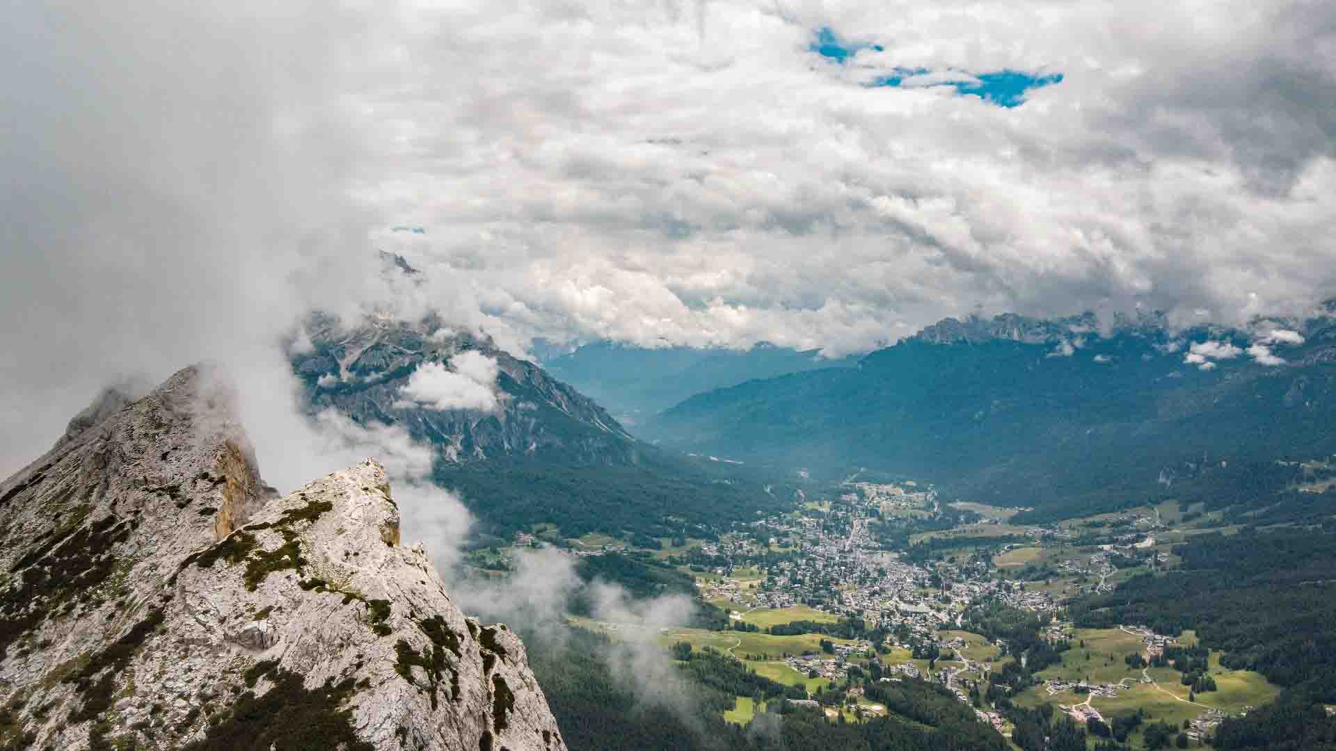 Arial shot of the summit and view of Cortina De’Ampezo below