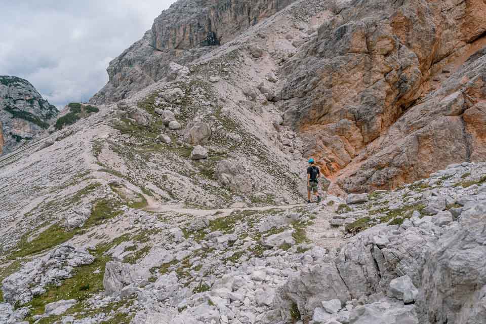 The descent trail down the steep scree valley